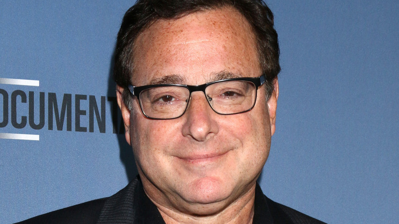 Bob Saget smirking