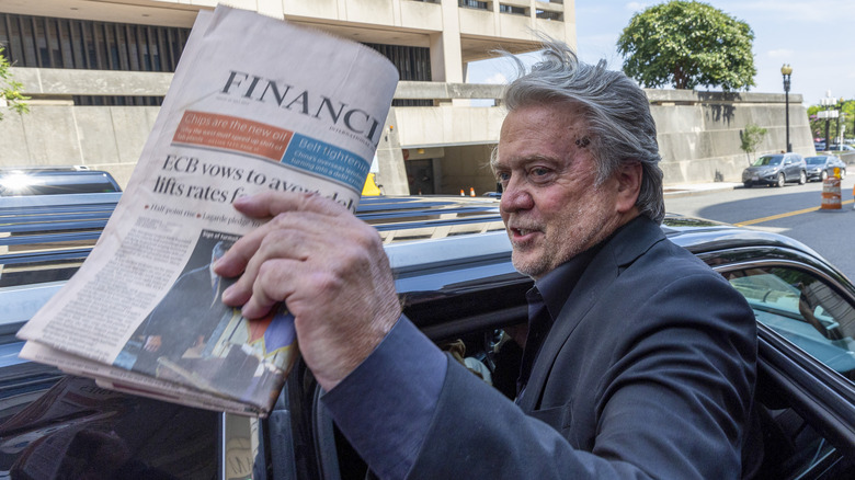 Steve Bannon waving newspaper