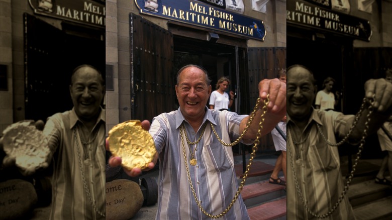 Mel Fisher posing with gold and jewelry