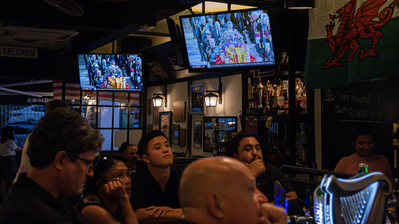 People watching TV in pub