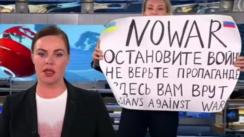 Marina Ovsyannikova holding sign