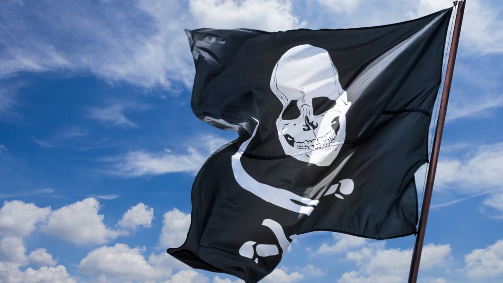 Pirate flag against blue sky