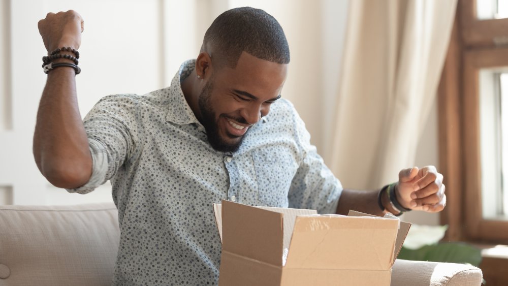 A man who is very, very excited about receiving a package