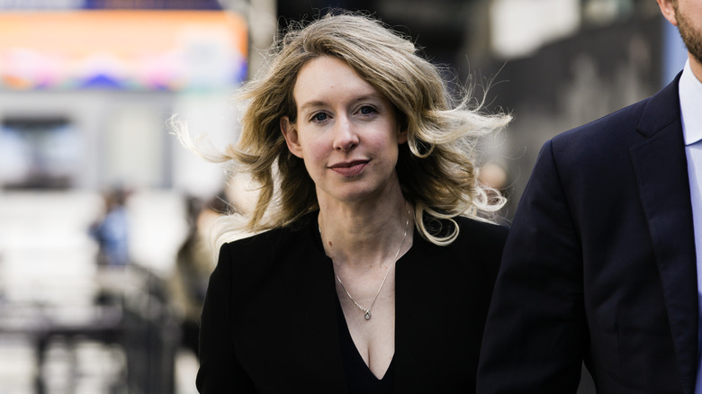 Elizabeth Holmes walking with boyfriend