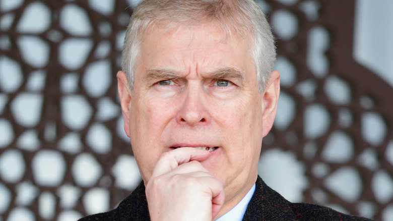 Prince Andrew biting finger