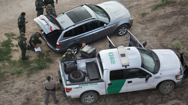 Aerial view car searched police bales of marijuana