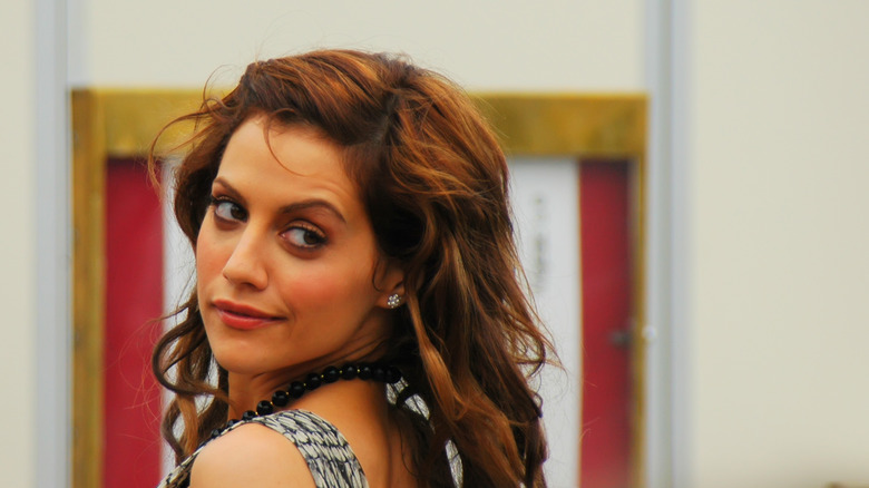 Brittany Murphy looking over her shoulder