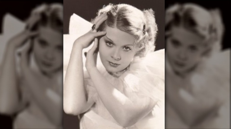 Dorothy Dell with hands on face