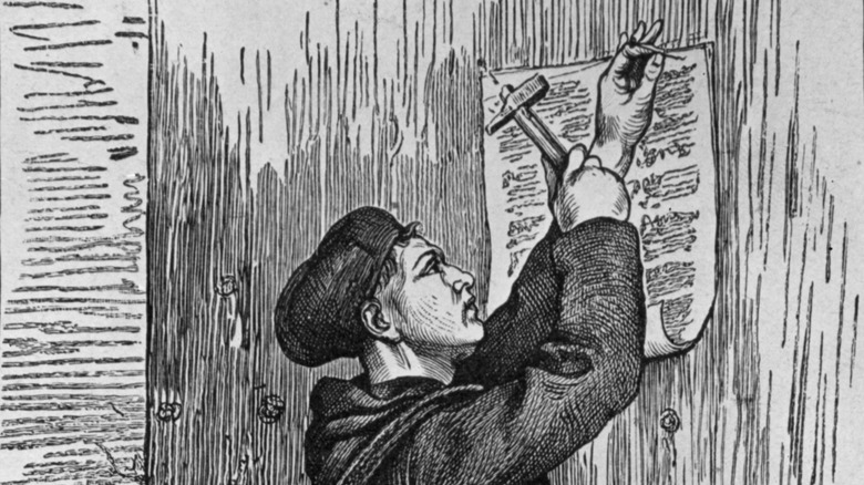martin luther nailing 95 theses to door