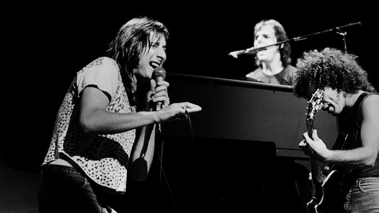 Steve Perry performing with Journey on stage