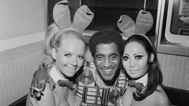 Photo of Sammy Davis, Jr. posing with Playmates