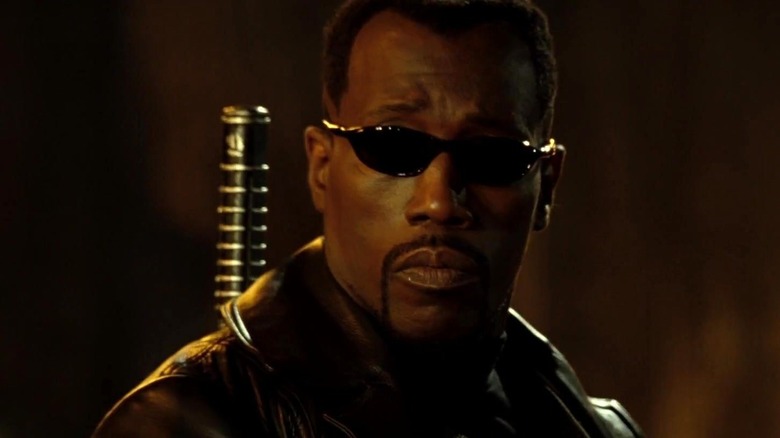 Wesley Snipes' Blade wearing sunglasses and looking to the side in Blade: Trinity