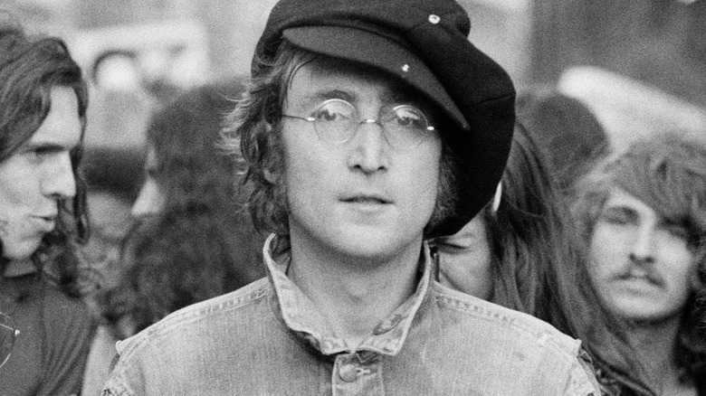 John Lennon standing in crowd