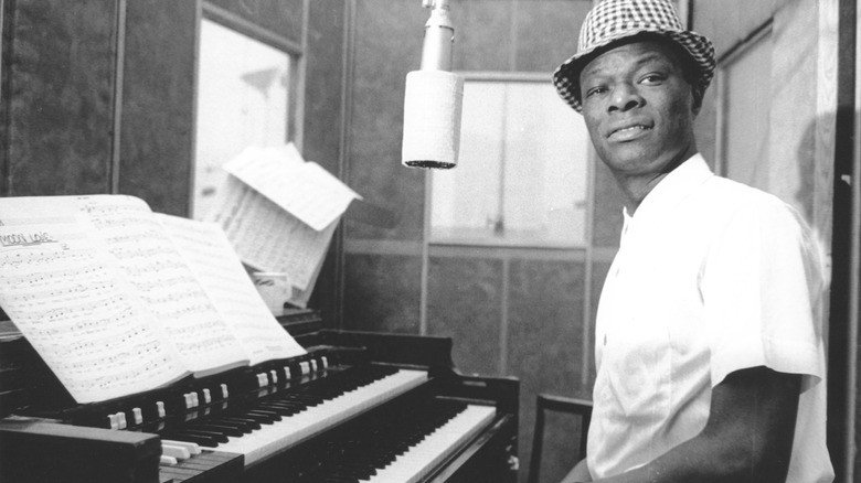 Nat King Cole sitting at piano