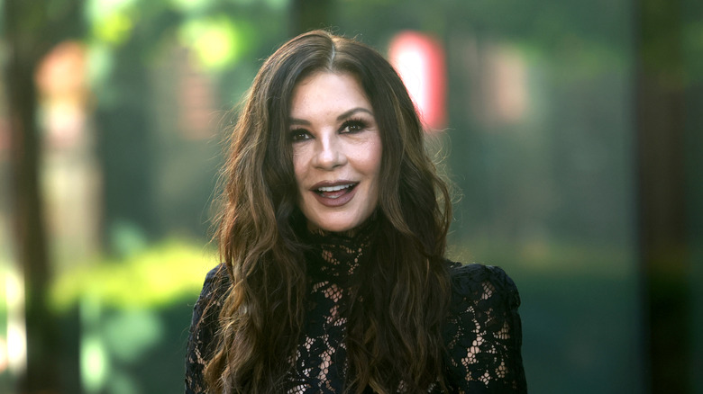 Catherine Zeta-Jones smiling for a photo in 2025