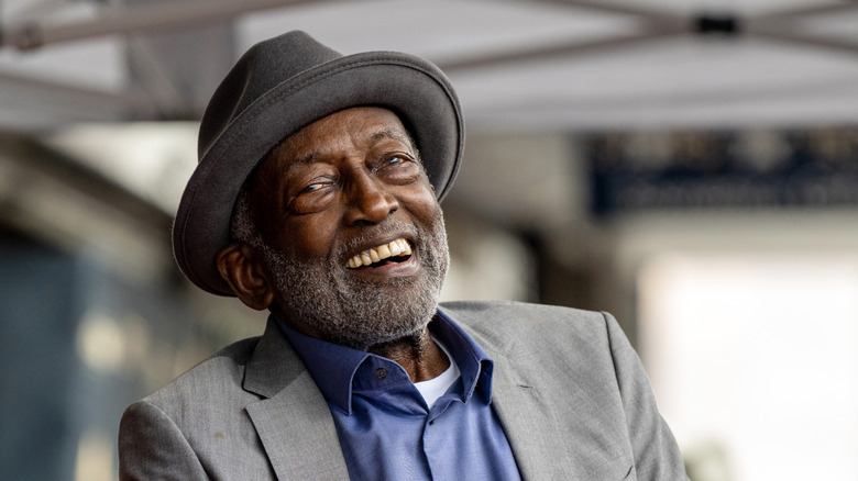 Garrett Morris wearing a hat and smiling in 2024