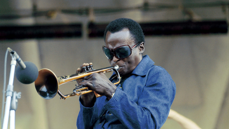 Miles Davis performing on stage at the Newport Jazz Festival in 1970