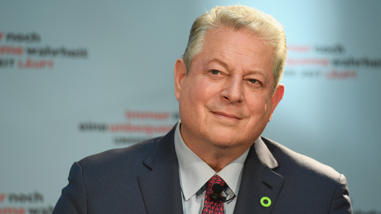Al Gore smiling at an environmental event