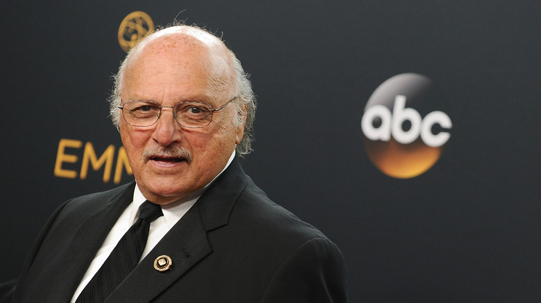 Dennis Franz in a suit on the Emmy's carpet