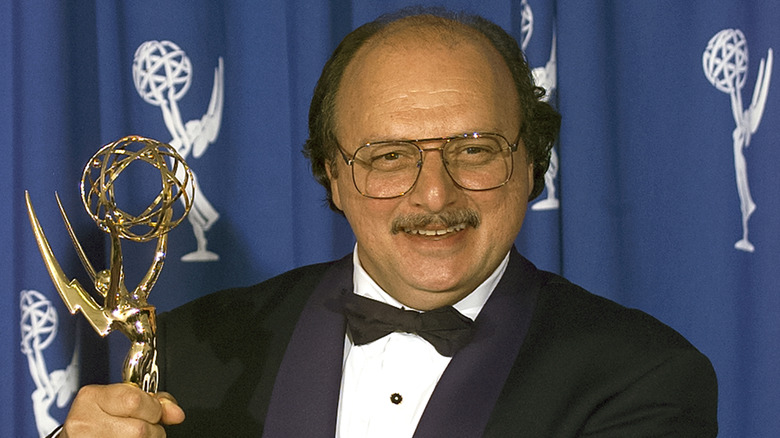 Dennis Franz holding an Emmy Award