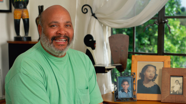 James Avery sitting in front of family photos