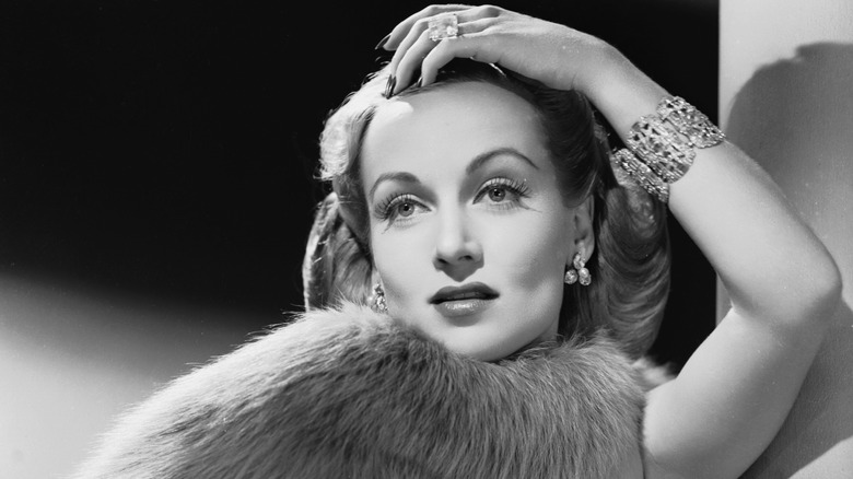 Carole Lombard posing dramatically in a film publicity shot