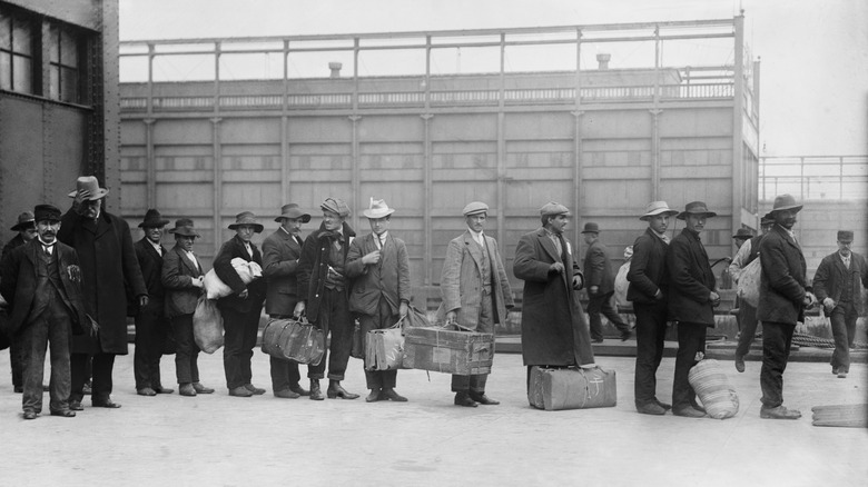 Immigrants line Ellis Island