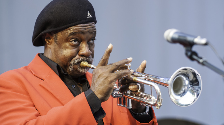 Ben Cauley wears kangol hat and plays trumpet