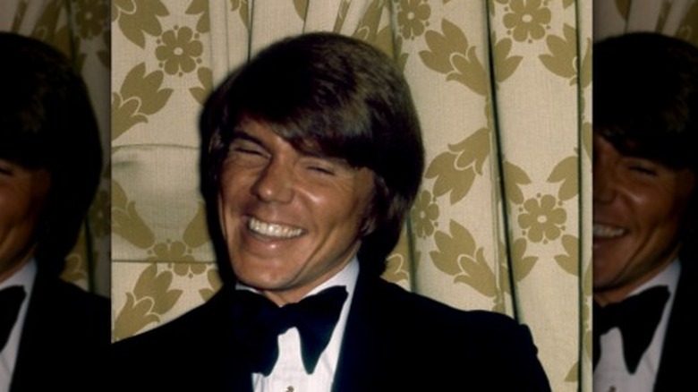 John Davidson smiling in bow tie