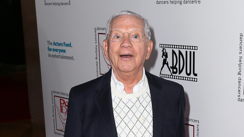 Robert Clary rearing back with open mouth at Hollywood function