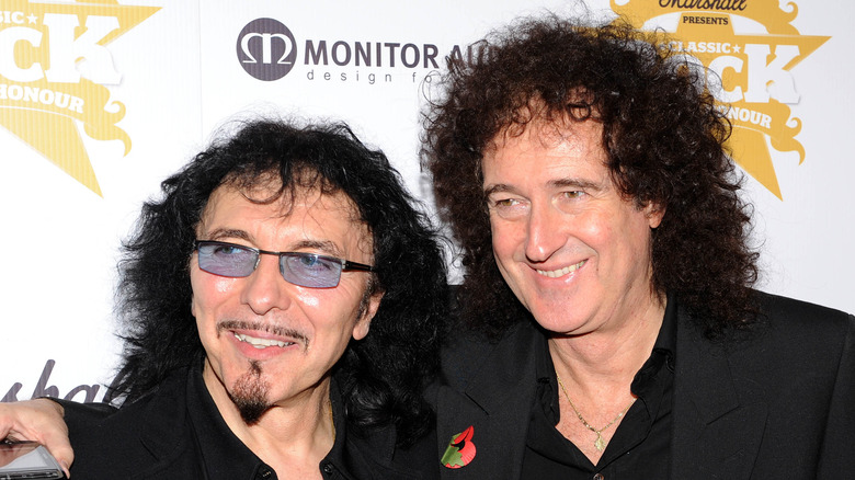 Brian May and Tony Iommi hugging