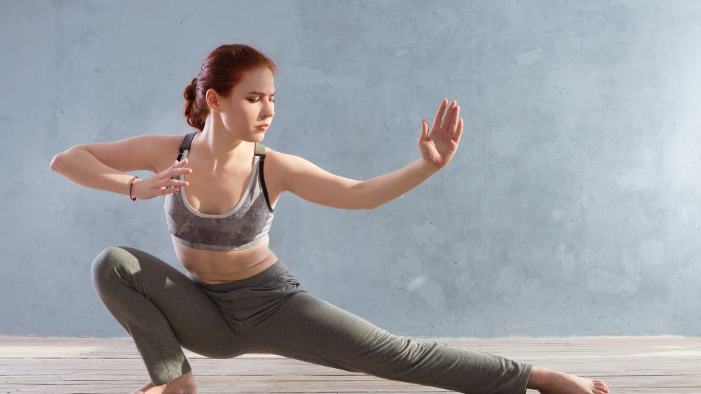 Young Woman Practicing Tai Chi