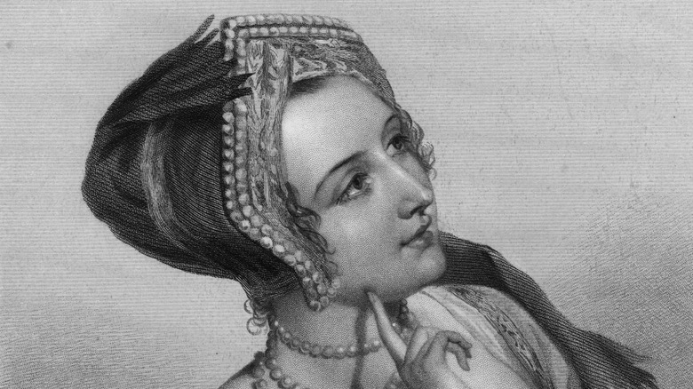 Anne Boleyn looking up fnger on chin