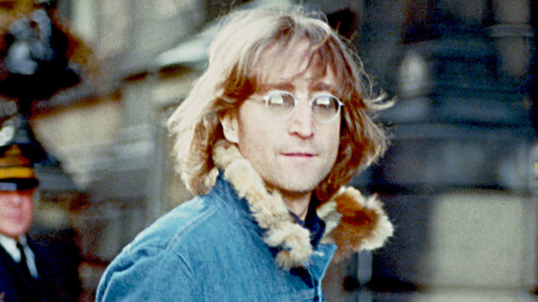 john lennon in jeans jacket on the street