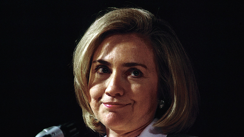 Hillary Clinton smiling before microphone
