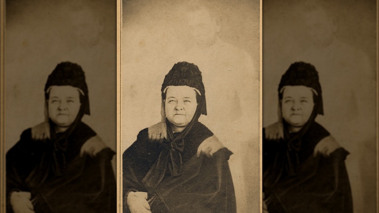 Mary Todd Lincoln sits with Lincoln ghost image