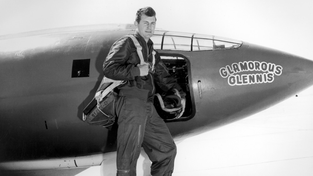 A young Chuck Yeager next to his X-1 aircraft, the Glamorous Glennis, which he used to break the sound barrier.