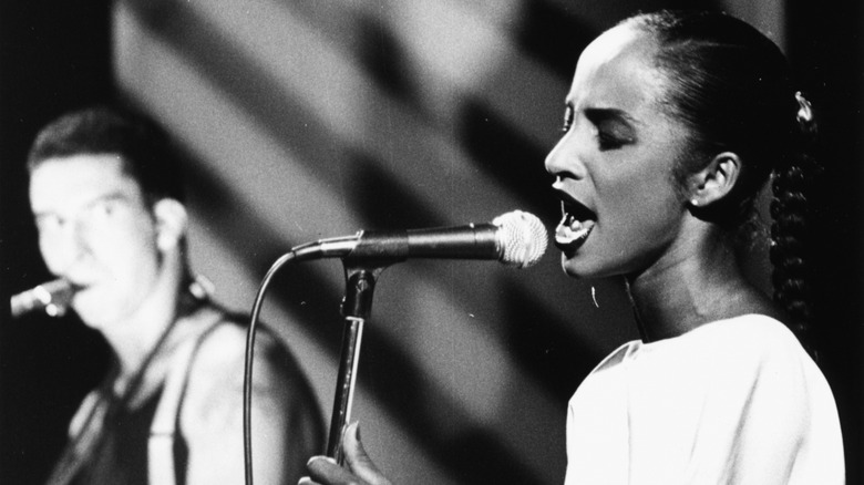 Sade performing live on stage in 80s