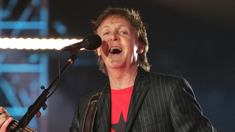 Paul McCartney singing and smiling