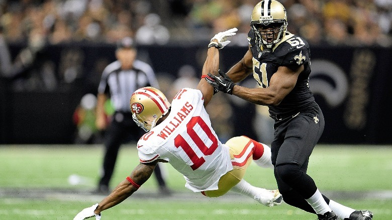 Jonathan Vilma tackling opponent