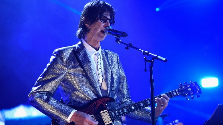 Ric Ocasek playing guitar onstage