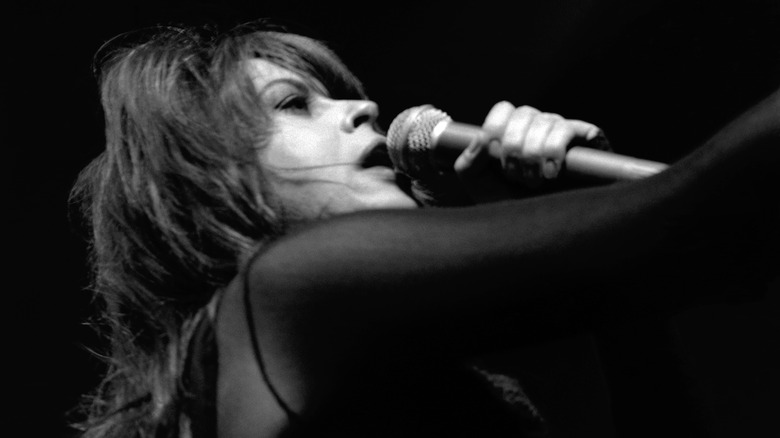 Chrissy Amphlett singing microphone onstage