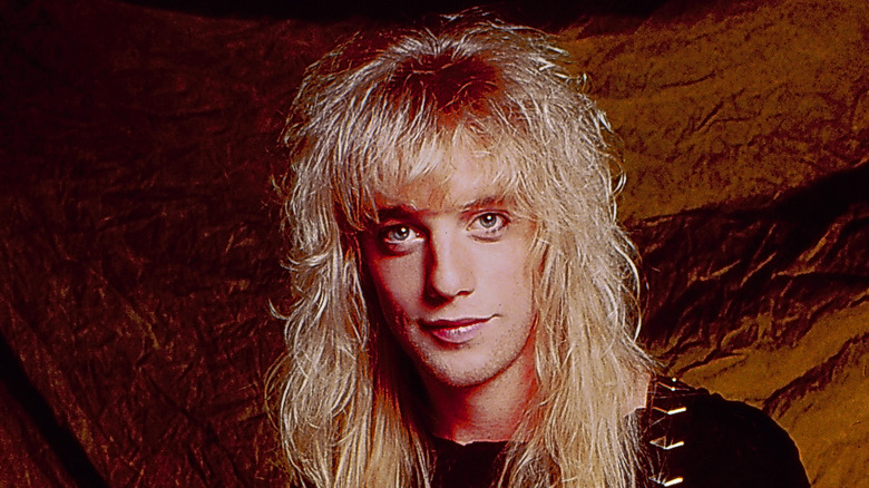 Jani Lane long blond hair amber background