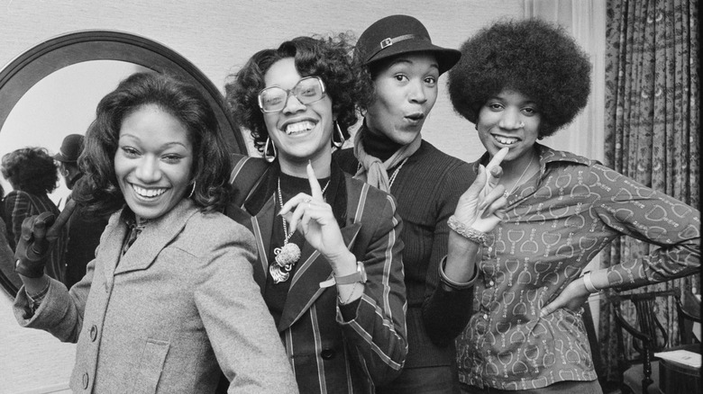 The Pointer Sisters all smiling