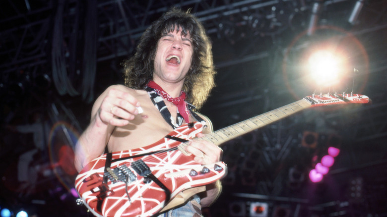 Eddie Van Halen playing guitar during concert