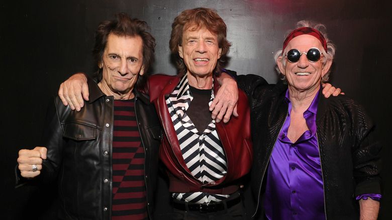 Ronnie Wood, Mick Jagger and Keith Richards posing for a photo