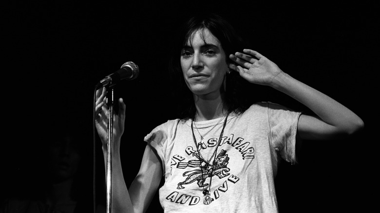 Black and white photo of Patti Smith performing onstage