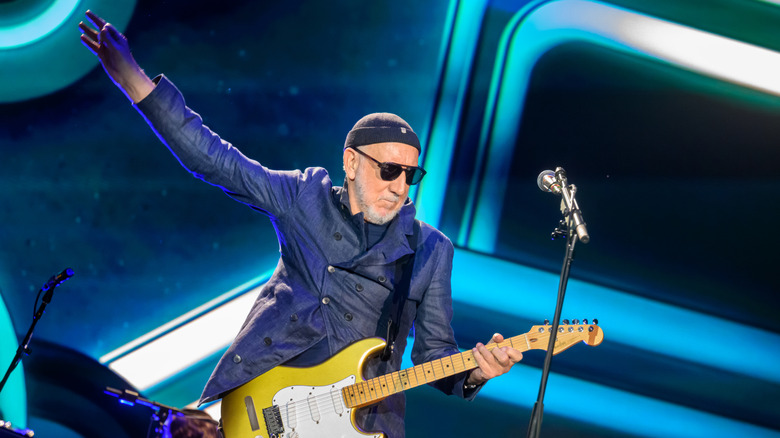 Pete Townshend doing his windmill guitar move while performing