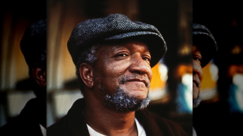 Redd Foxx smiling in cap