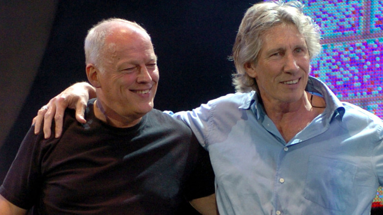 Roger Waters embracing David Gilmour